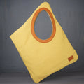 diamond shaped tote bag with leather lined hole
